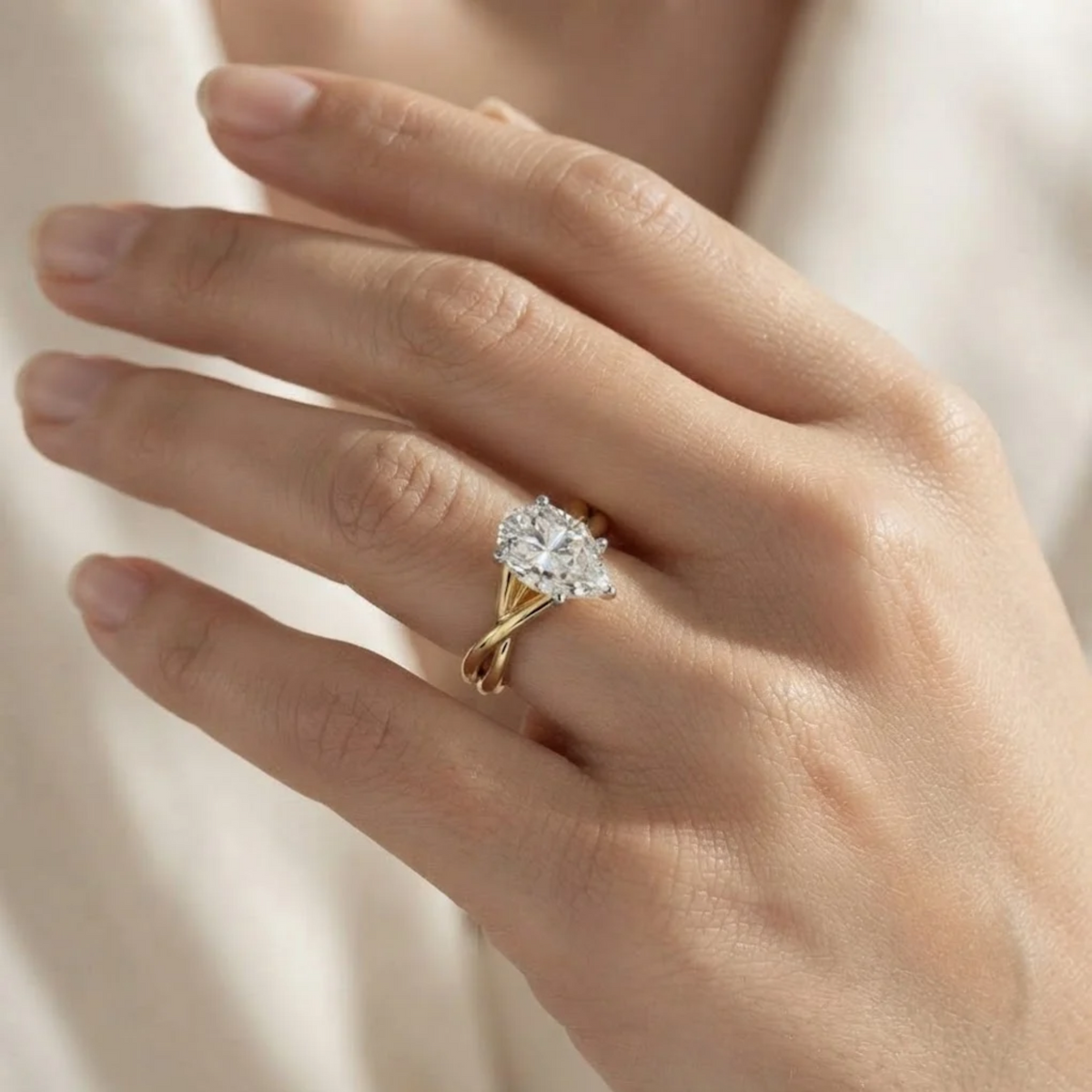 Pear shape lab grown diamond Twisted engagement ring