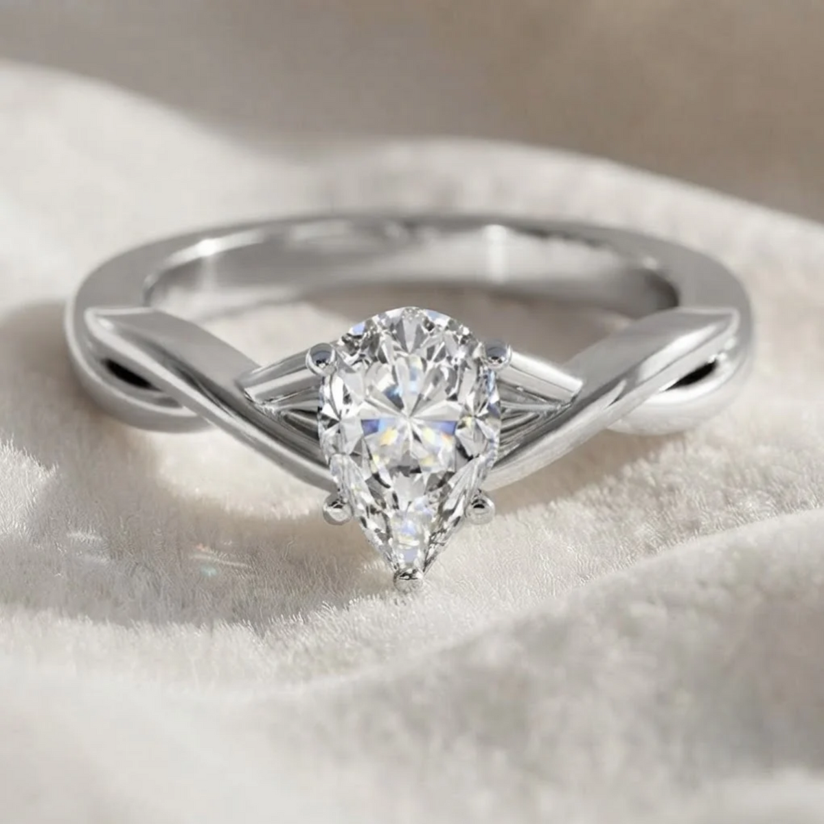 Pear shape lab grown diamond Twisted engagement ring