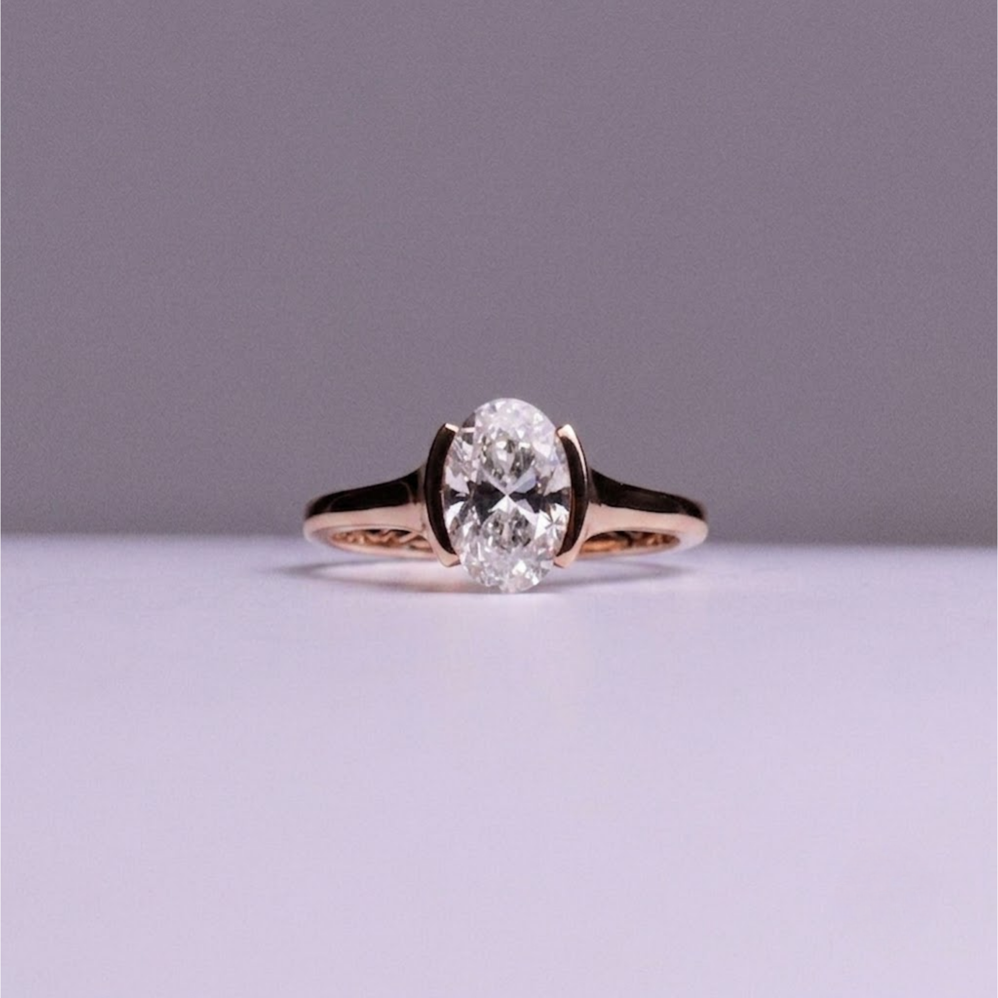 Oval Half Bezel Solitaire Engagement Ring