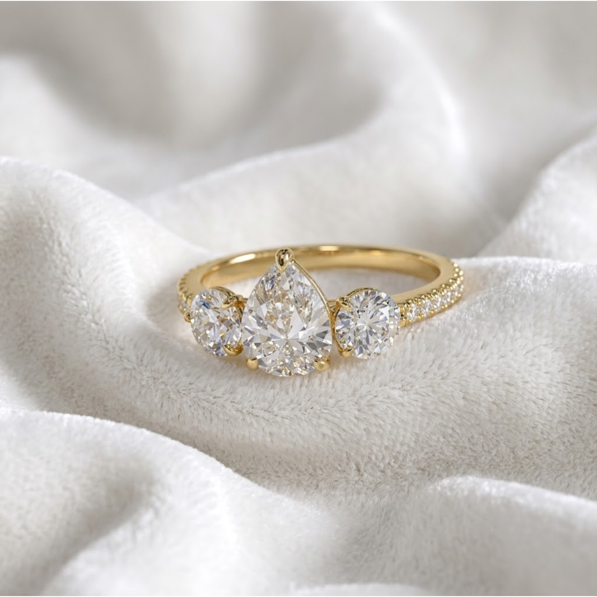 Pear Shaped Three Stone Solitaire Engagement Ring
