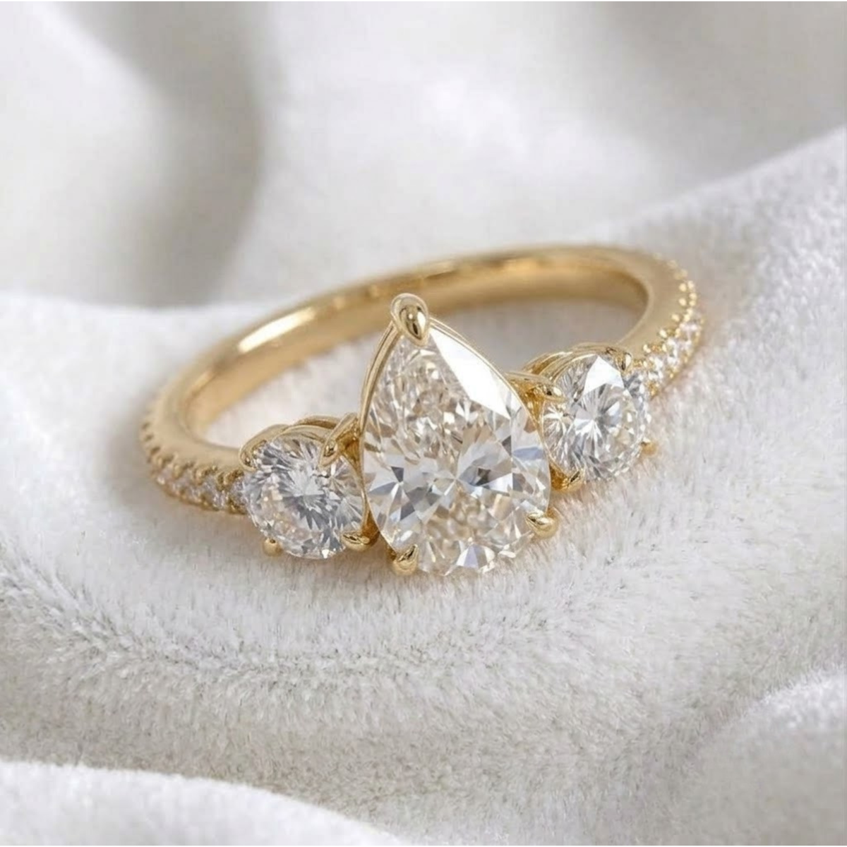 Pear Shaped Three Stone Solitaire Engagement Ring