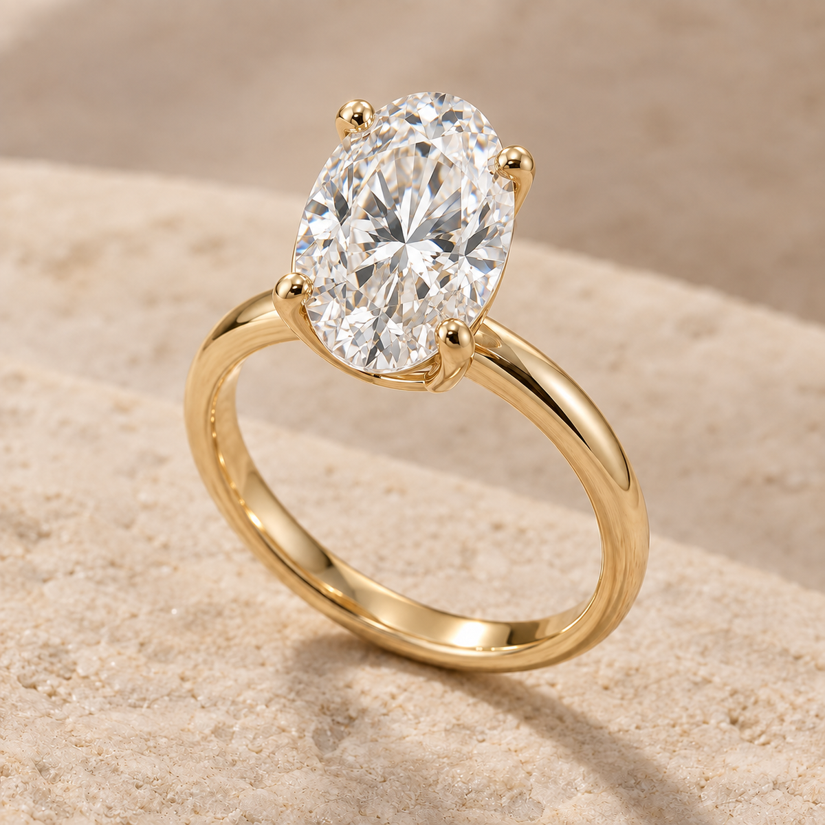 AI-generated preview of a 2 ct oval lab-grown diamond solitaire ring in 14K yellow gold on an ivory stone surface.