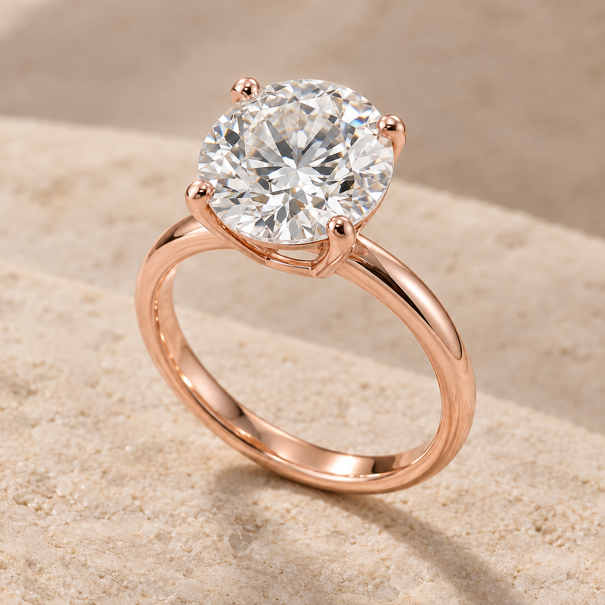 AI-generated preview of a 2 ct round lab-grown diamond solitaire ring in 14K rose gold on an ivory stone surface.
