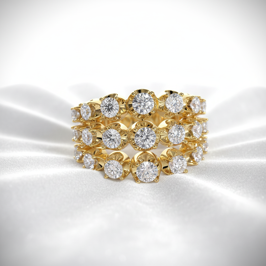 Three 14K gold diamond wedding bands stacked on wavy white velvet, studio lighting
