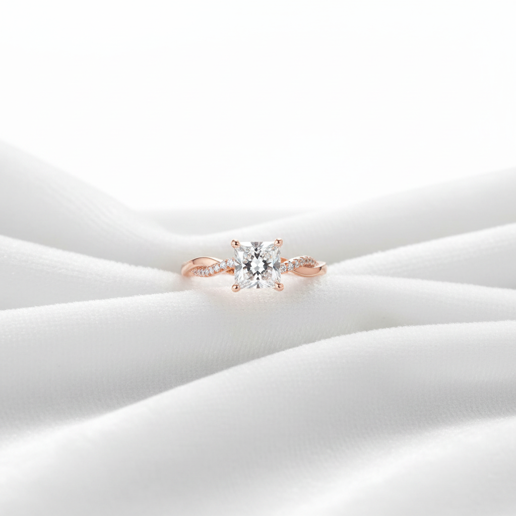 14K rose gold princess cut pave twisted band engagement ring on wavy white velvet, studio lighting