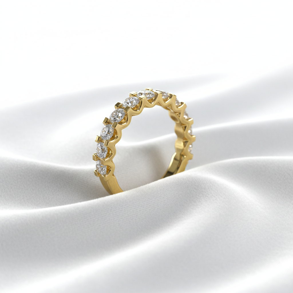 14K yellow gold women's half eternity wedding band on wavy white velvet, studio lighting