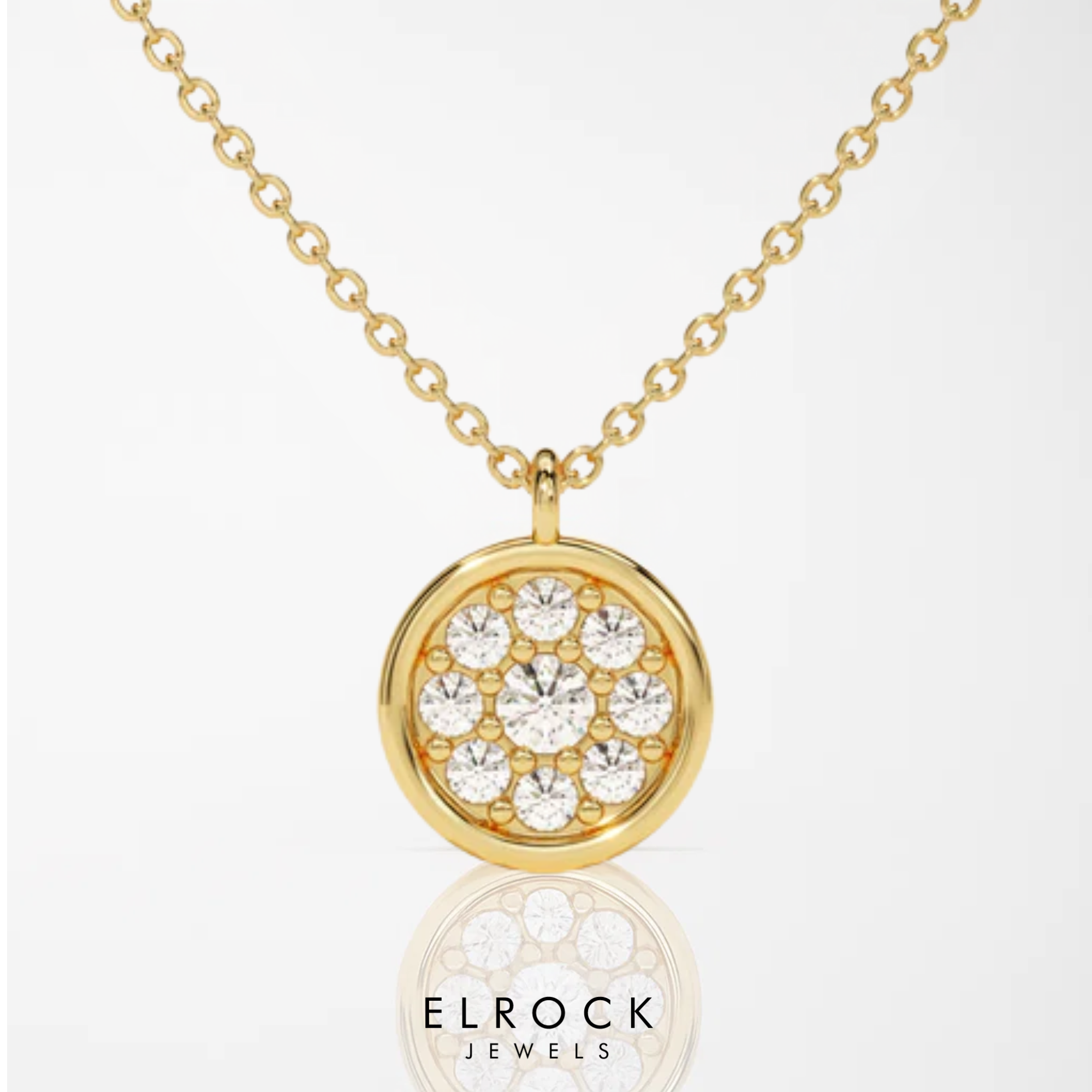 Gold necklace with a round pendant featuring crystals 