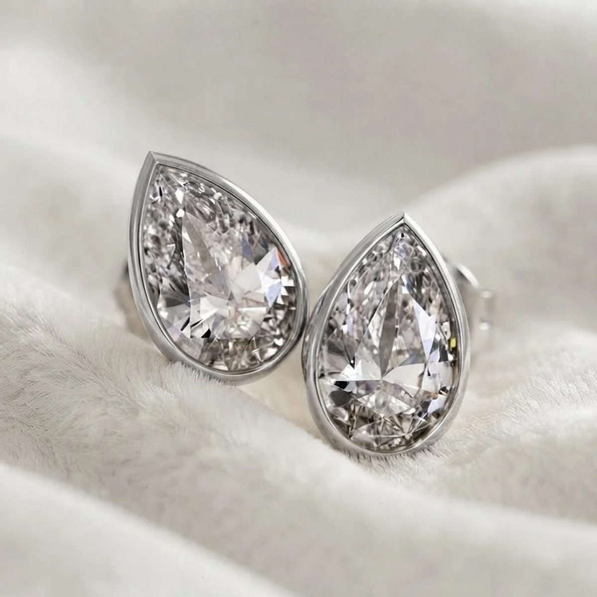 Bezel Set Pear Shape Lab Grown Diamond Stud Earrings