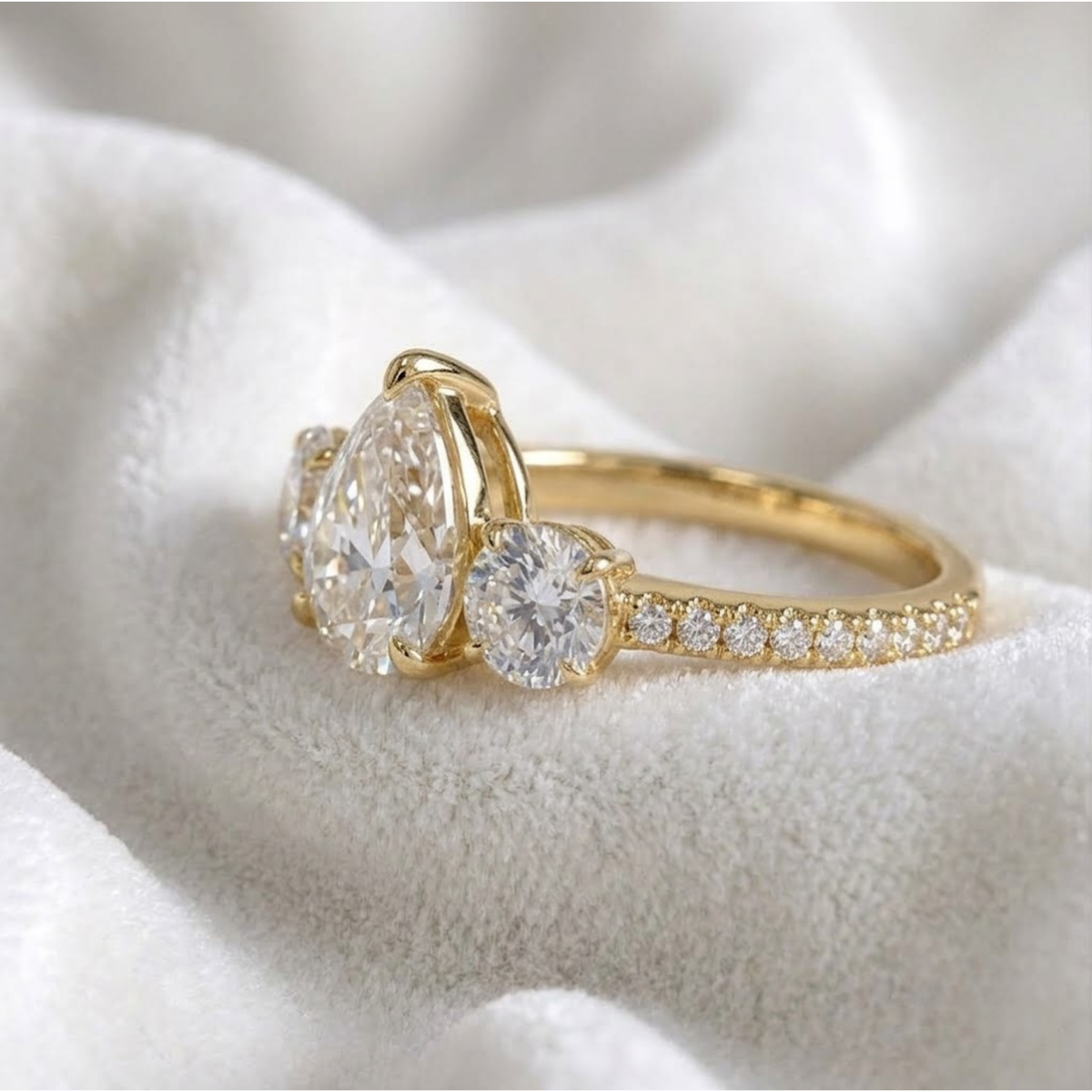 Pear Shaped Three Stone Solitaire Engagement Ring