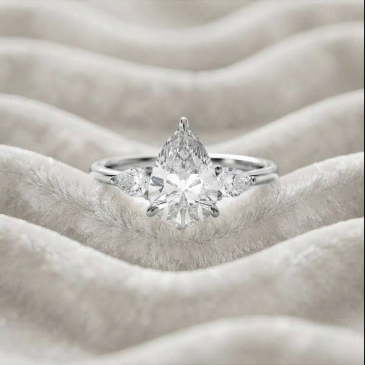 Pear Shaped Three Stone Engagement Ring