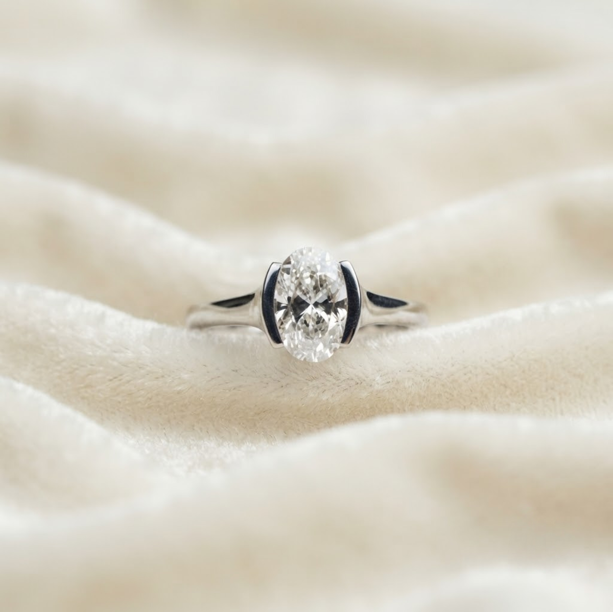 Oval Half Bezel Solitaire Engagement Ring