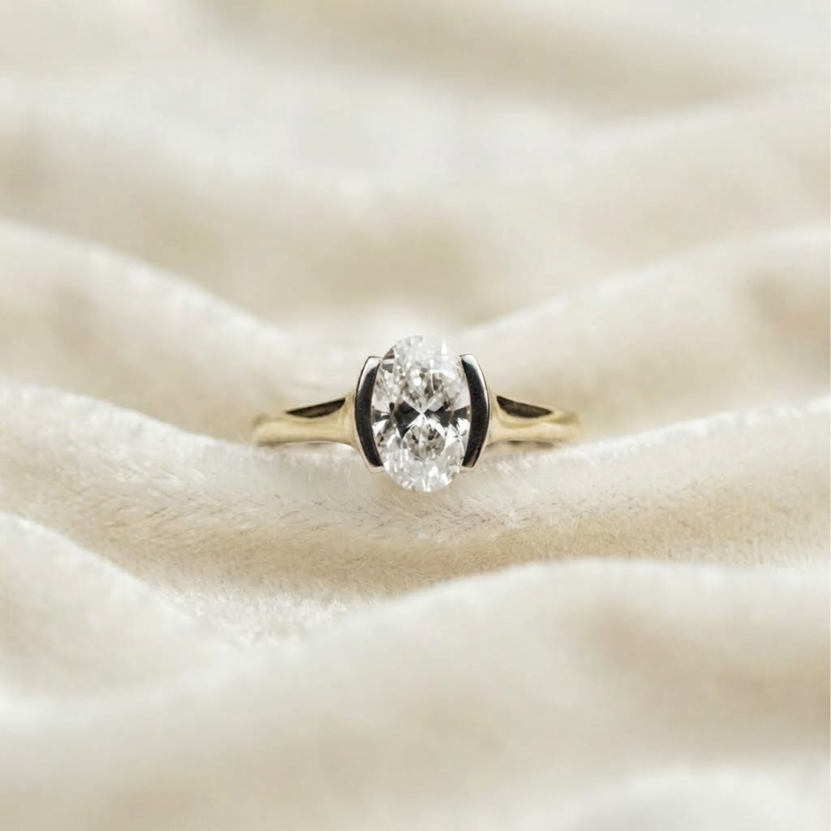 Oval Half Bezel Solitaire Engagement Ring