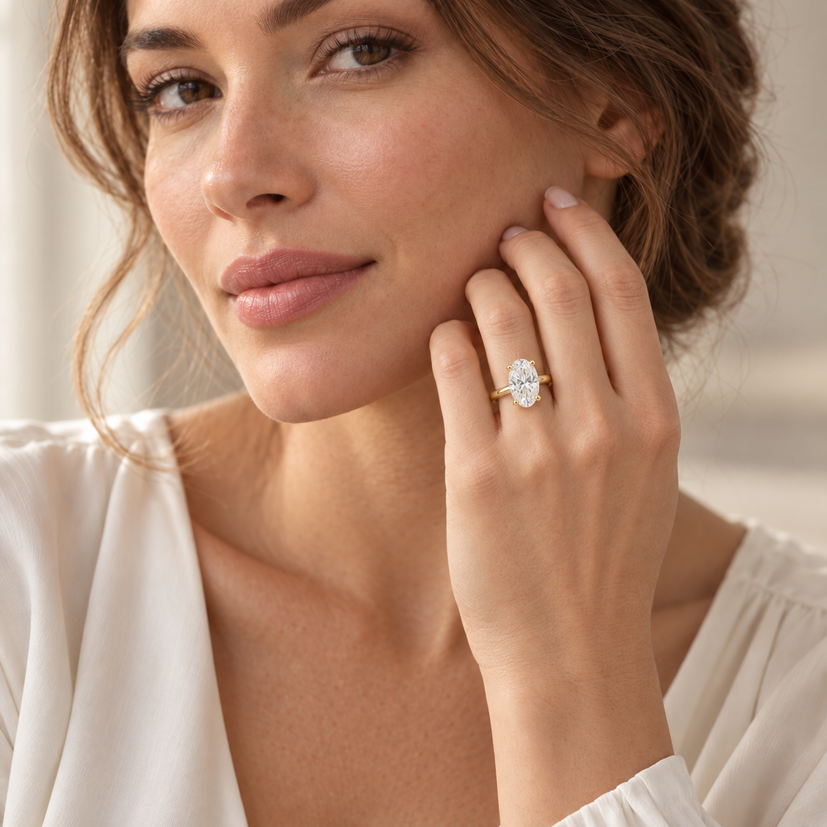 AI-generated model wearing the 2 ct oval yellow gold solitaire ring with her hand near her face.