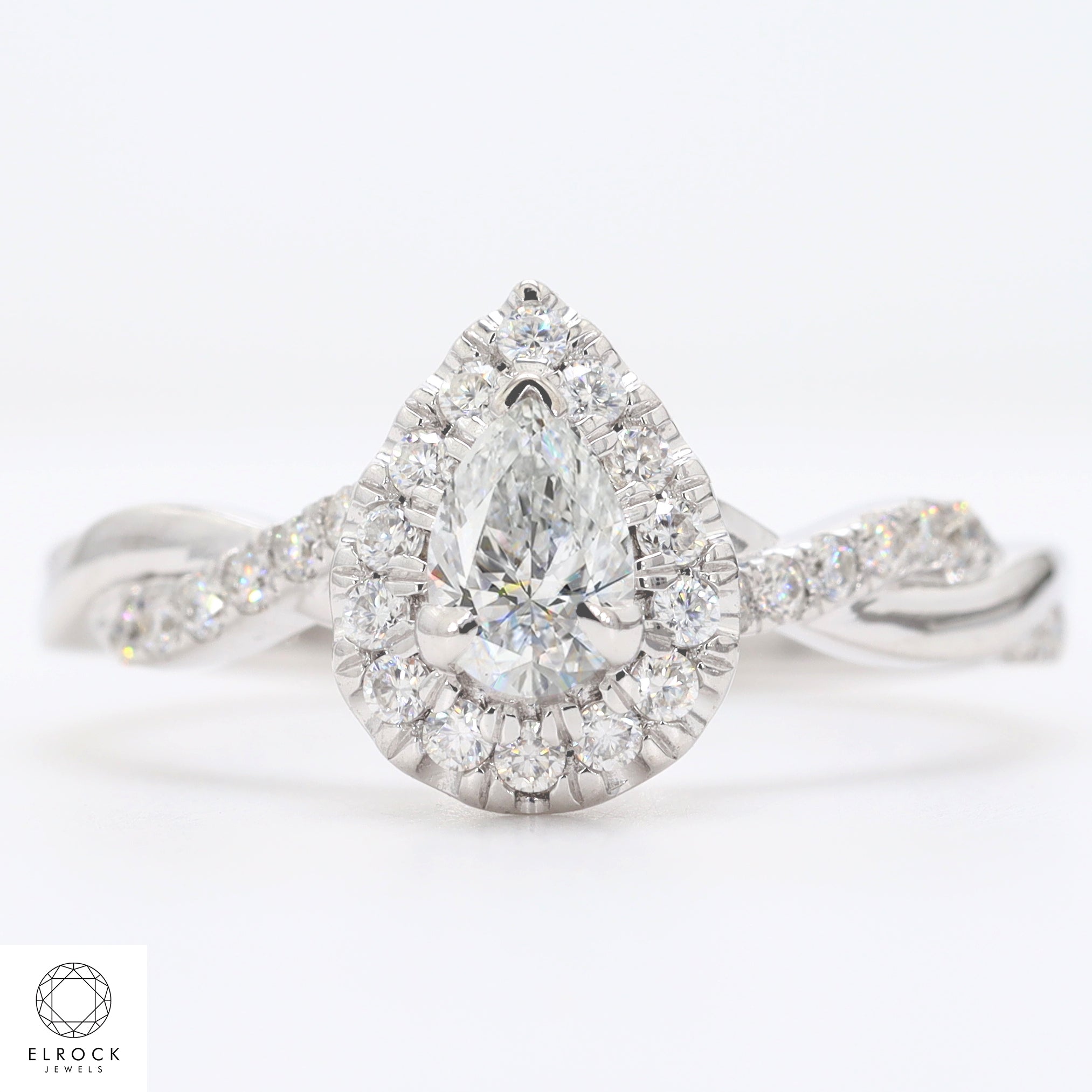 14K Pear Shape Twist and turn Prong Solitaire Engagement Ring
